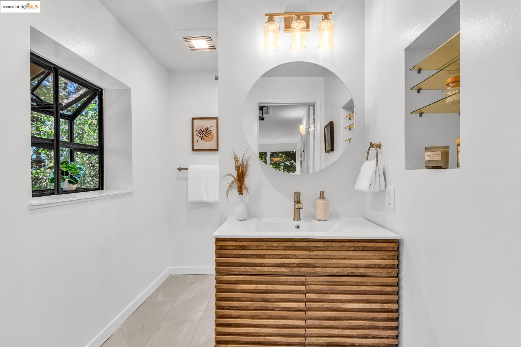 2211 Arrowhead Drive Oakland, CA 94611 - Photo 42 of 52 Bathroom featuring vanity and light tile patterned floors