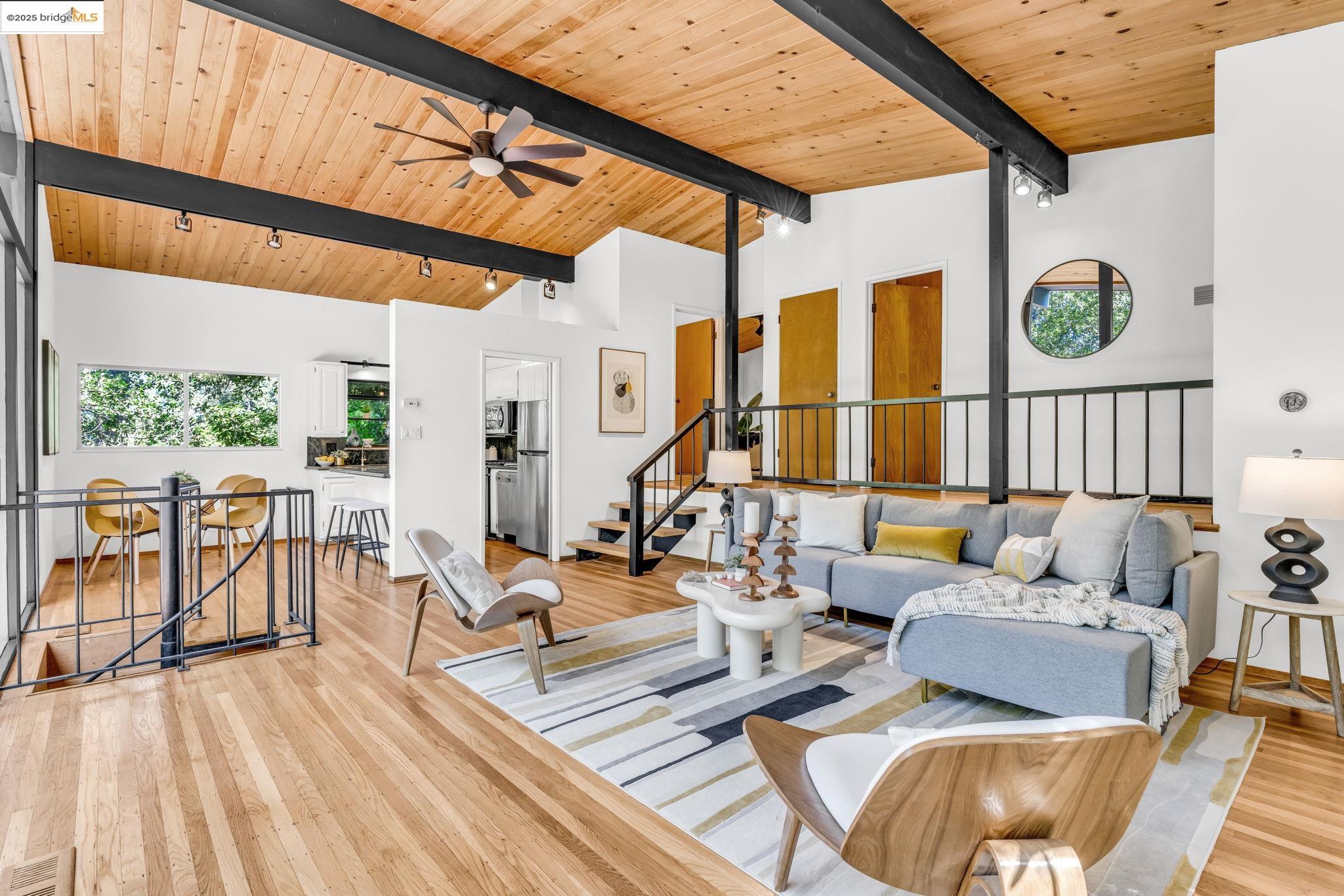 2211 Arrowhead Drive Oakland, CA 94611 - Photo 9 of 52 Living room featuring stairway, high vaulted ceiling, a wooden ceiling with exposed beams, light wood finished floors, and ceiling fan