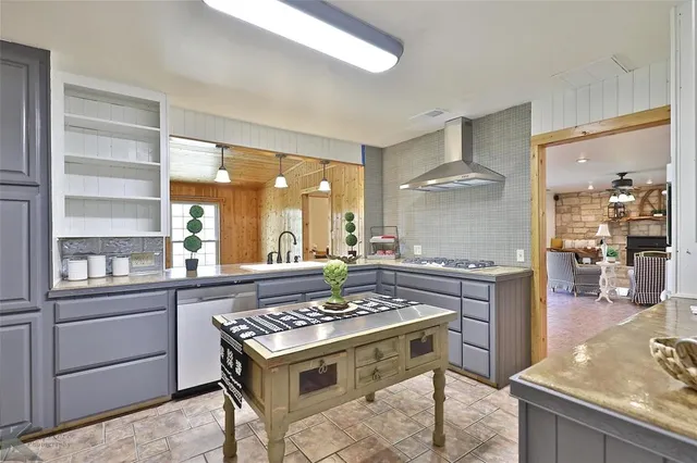 a kitchen with a stove and a sink