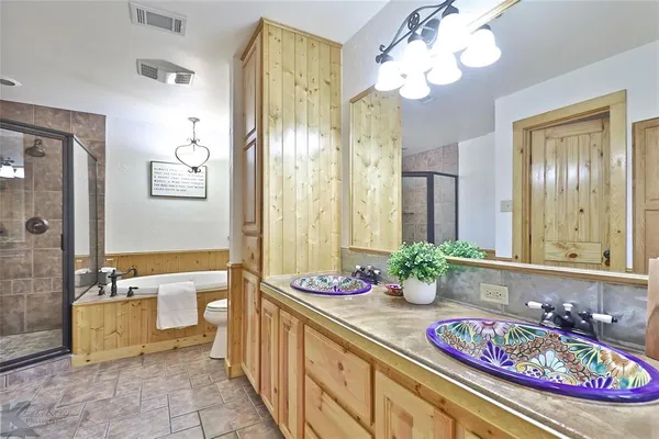 a bathroom with sink and mirror