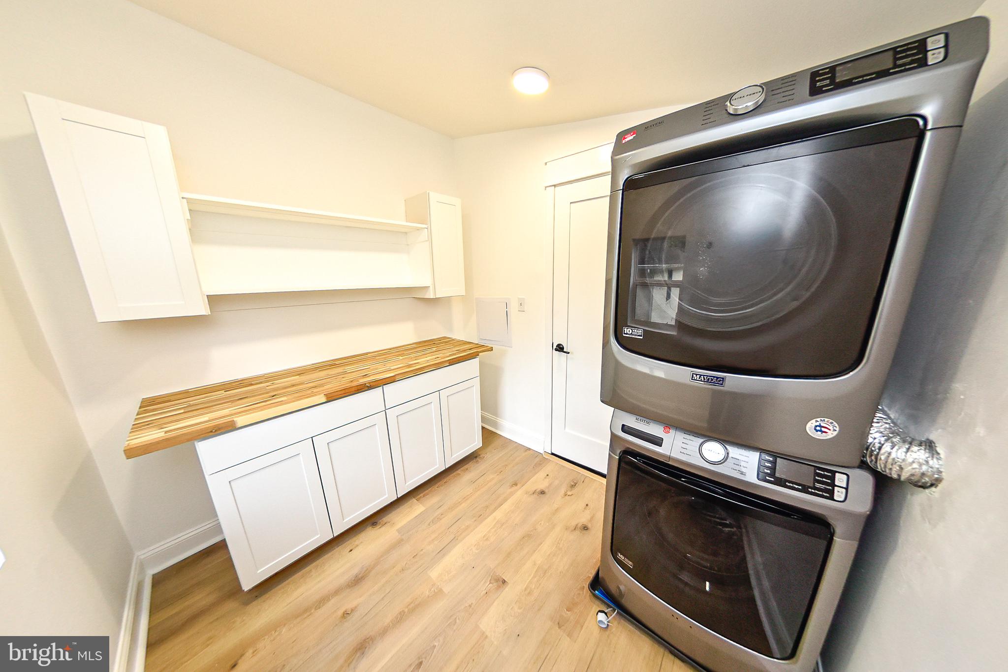 3704 Suitland Road Southeast Washington, DC 20020 - Photo 45 of 70 Modern laundry space with sleek appliances.