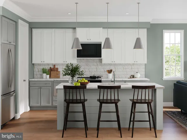 a kitchen with a table chairs refrigerator and microwave