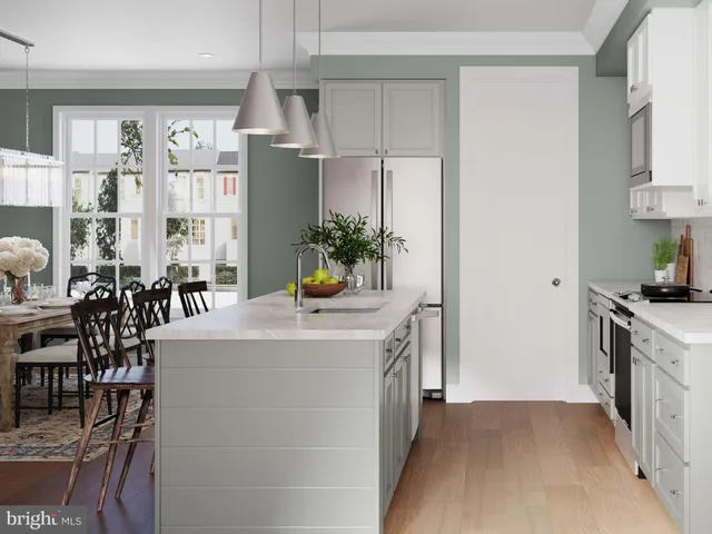 a kitchen with counter top space and windows