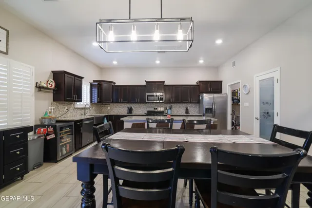 a bedroom with double bed and a large mirror