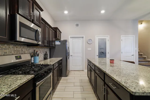 a bedroom with furniture and baby crib