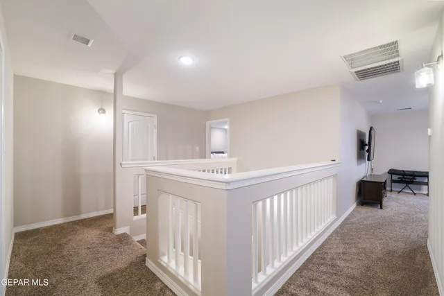 a bathroom with a granite countertop sink a double vanity and a mirror