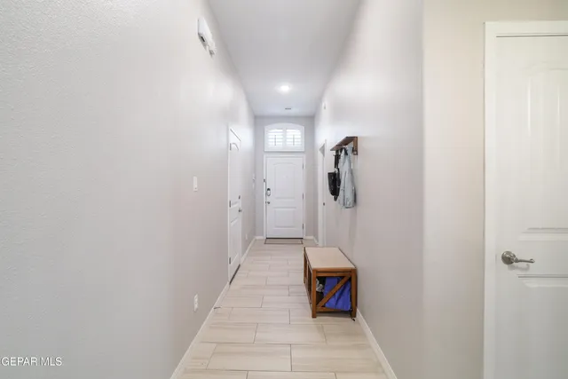 a bathroom with a granite countertop sink and a mirror with toilet