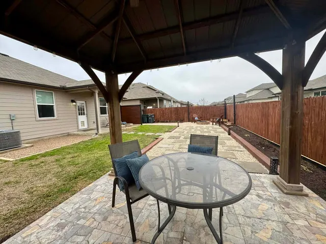 a room with a fireplace and cabinets