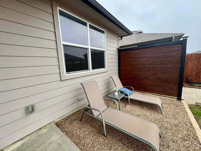 an aerial view of a house with a ocean view
