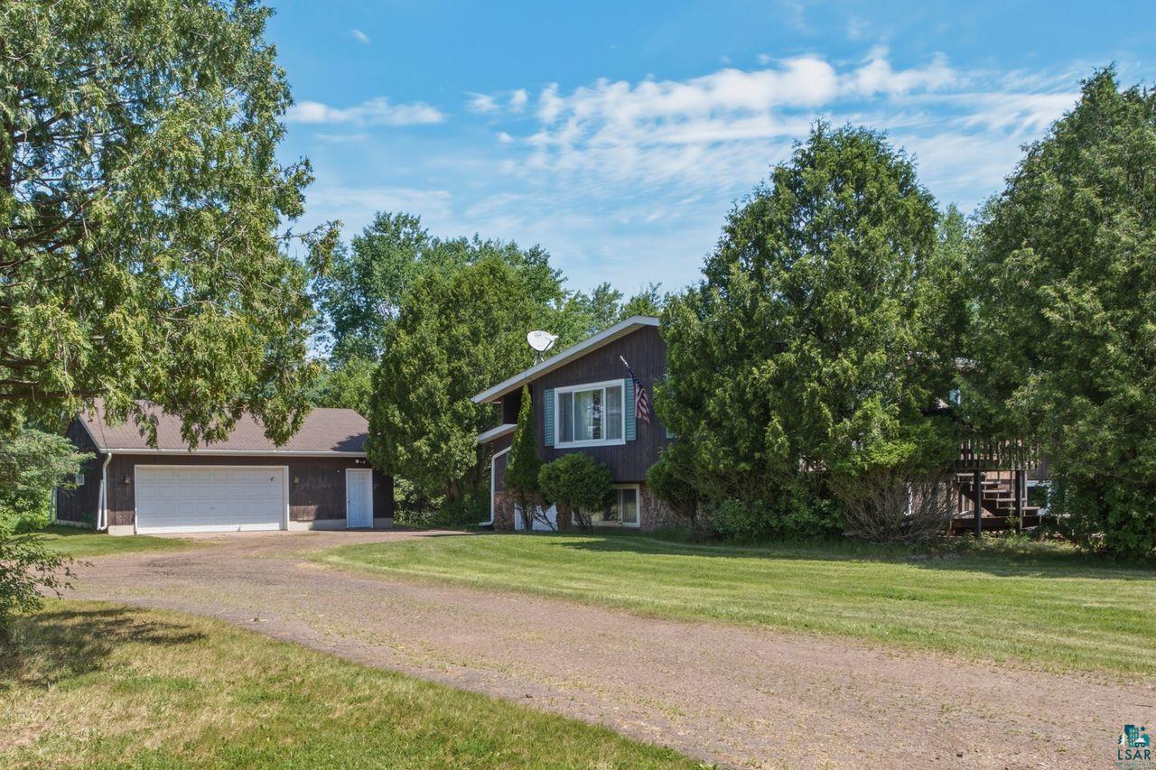 61018 Dahlstrom Road Ashland, WI 54806 - Photo 26 of 28 Ranch-style residence featuring brown siding, white-framed windows, and a partially visible deck