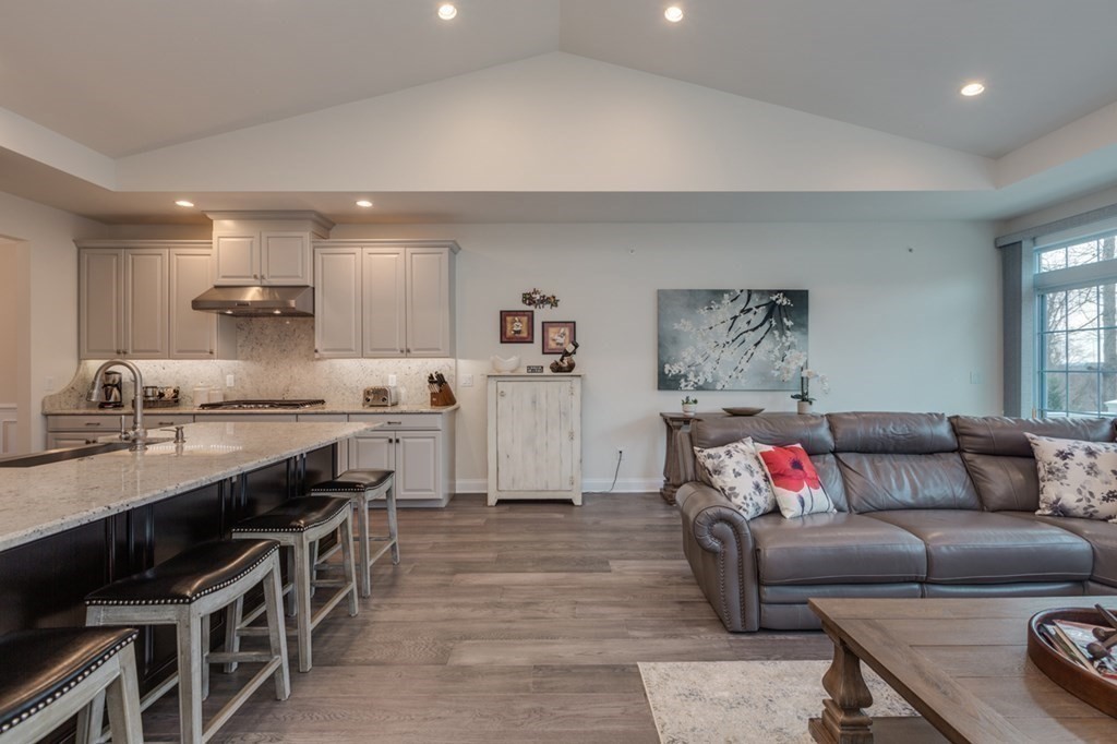 3 Hummingbird Way, Unit 3 Methuen, MA 01844 - Photo 11 of 36 a living room with furniture and kitchen view