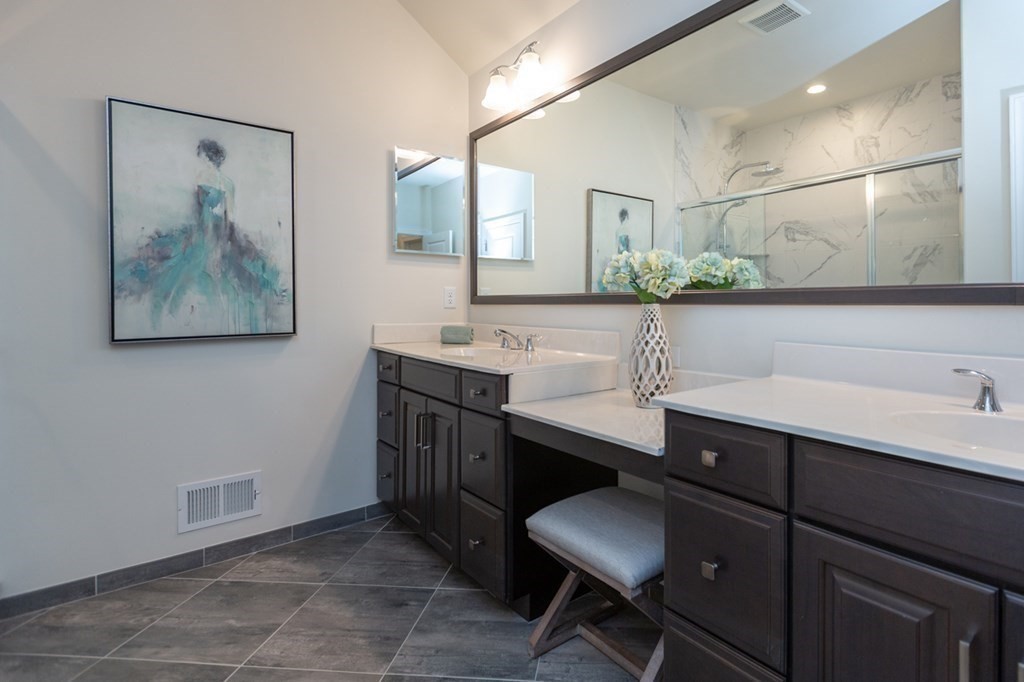 3 Hummingbird Way, Unit 3 Methuen, MA 01844 - Photo 19 of 36 a bathroom with a sink and a mirror