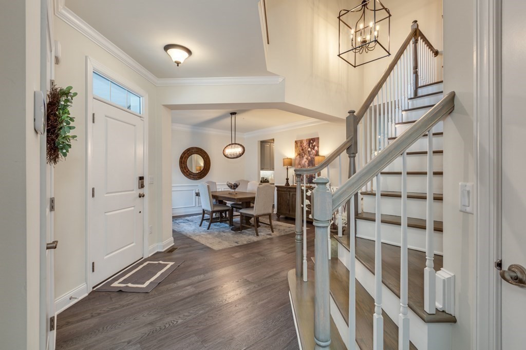 3 Hummingbird Way, Unit 3 Methuen, MA 01844 - Photo 2 of 36 a view of entryway with wooden floor and a chandelier