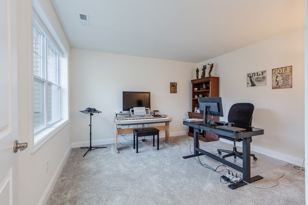 3 Hummingbird Way, Unit 3 Methuen, MA 01844 - Photo 22 of 36 a view of a workspace with furniture and a window