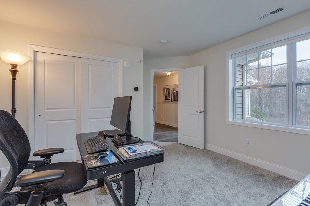 3 Hummingbird Way, Unit 3 Methuen, MA 01844 - Photo 23 of 36 a view of a workspace with furniture and a window