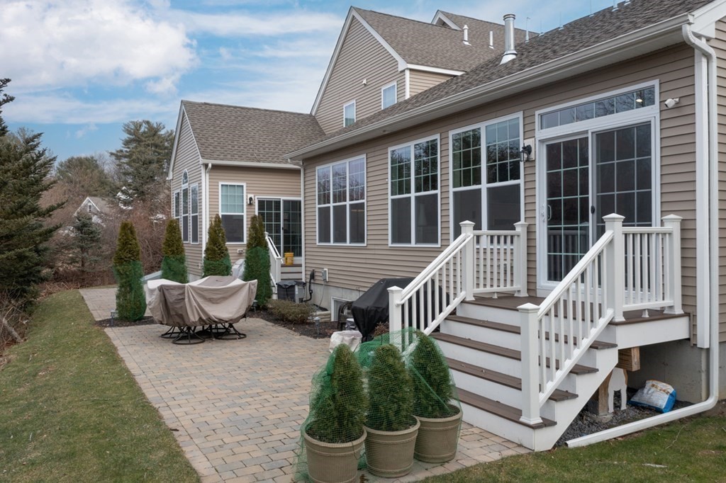 3 Hummingbird Way, Unit 3 Methuen, MA 01844 - Photo 28 of 36 a view of a house with backyard and sitting area