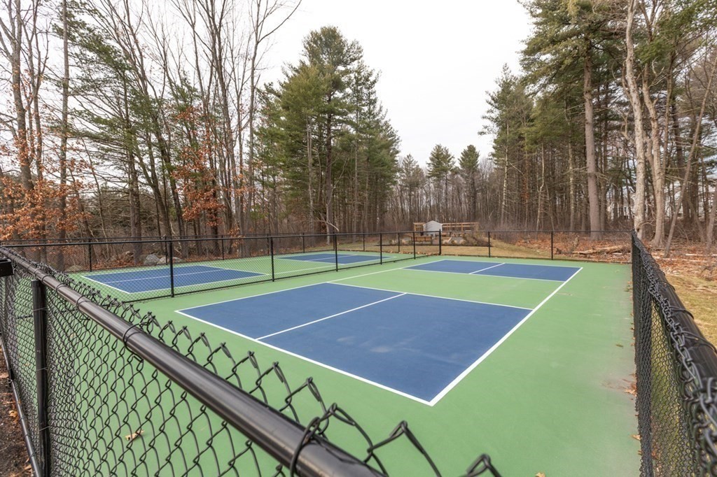 3 Hummingbird Way, Unit 3 Methuen, MA 01844 - Photo 32 of 36 a view of a tennis ground with large trees