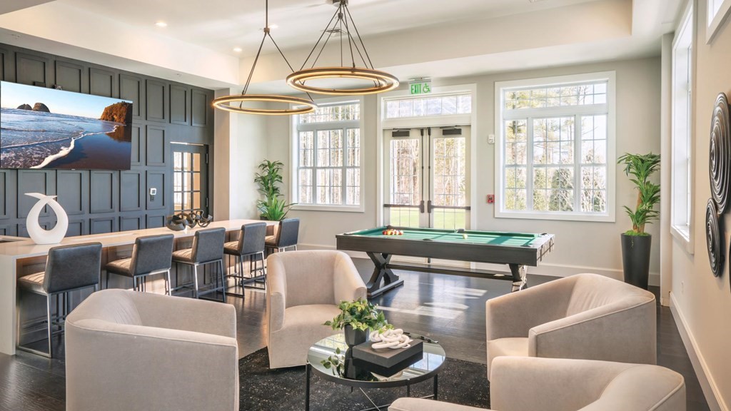 3 Hummingbird Way, Unit 3 Methuen, MA 01844 - Photo 34 of 36 a living room with furniture and a chandelier