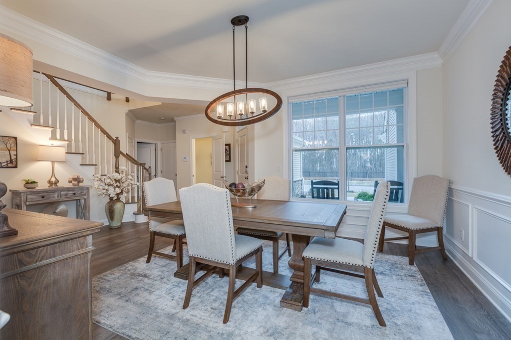 3 Hummingbird Way, Unit 3 Methuen, MA 01844 - Photo 4 of 36 a view of a dining room with furniture window and wooden floor