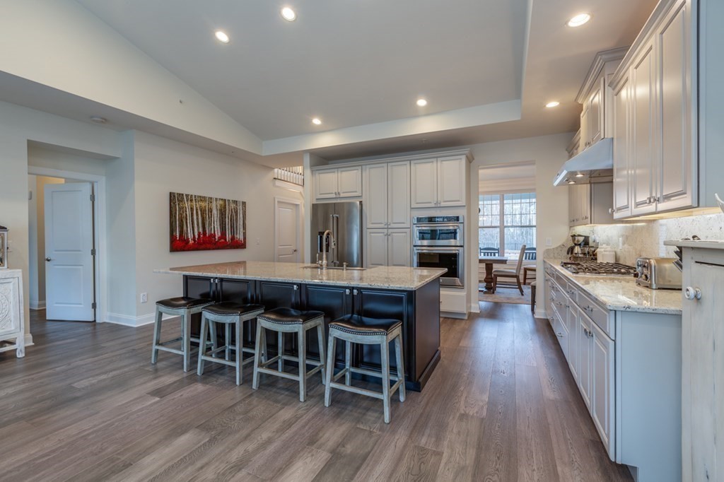 3 Hummingbird Way, Unit 3 Methuen, MA 01844 - Photo 10 of 36 a large kitchen with lots of counter space and stainless steel appliances