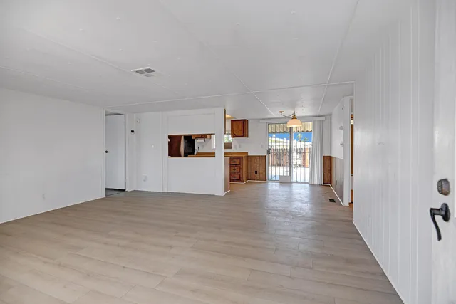 a view of a kitchen with wooden floor