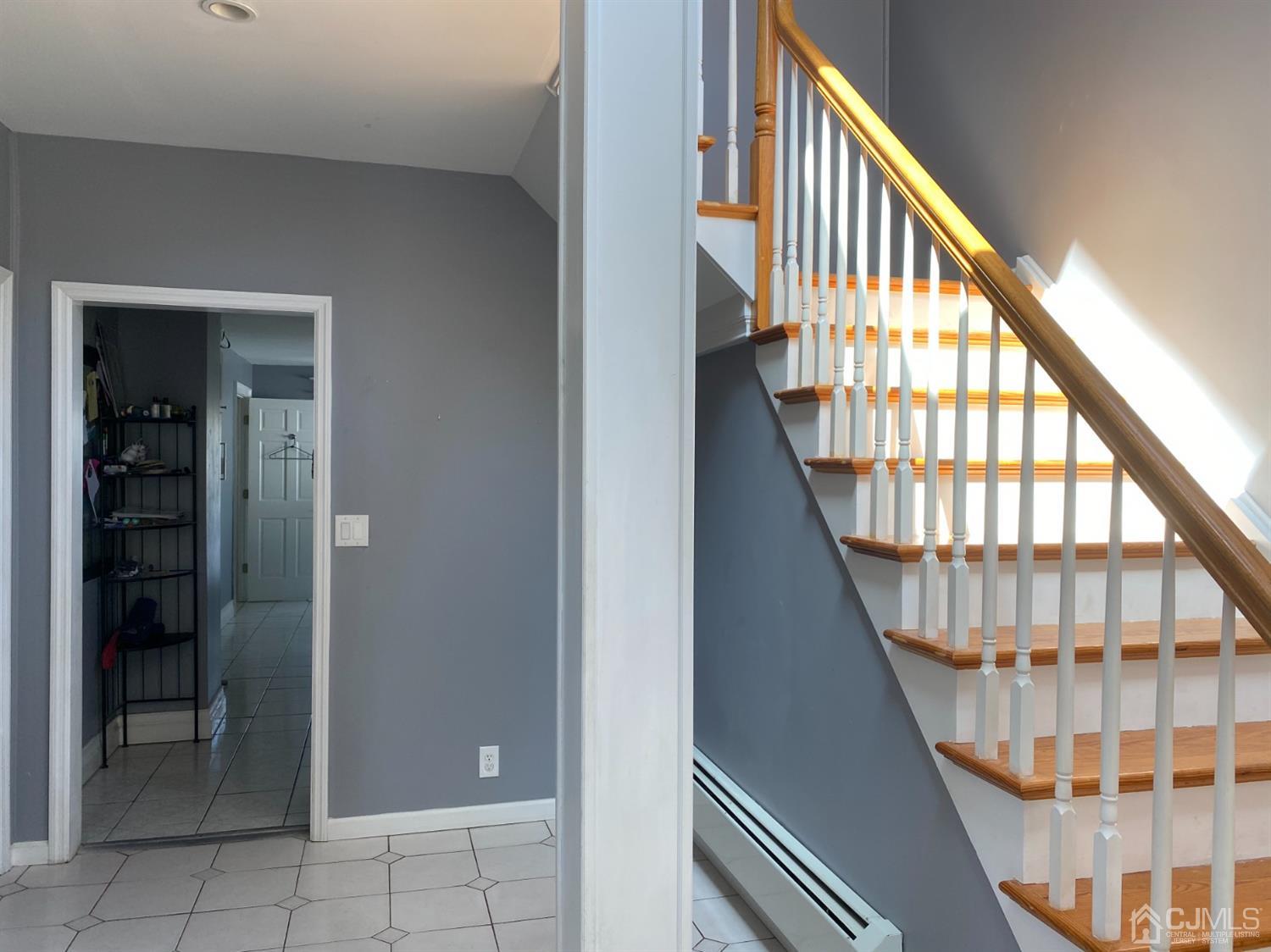 332 New Market Road Dunellen, NJ 08812 - Photo 3 of 16 a view of entryway with wooden floor