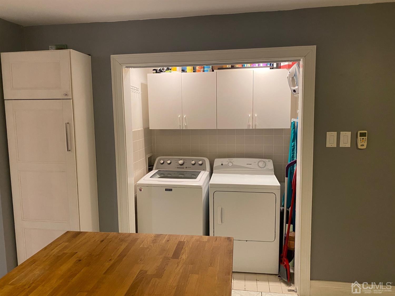 332 New Market Road Dunellen, NJ 08812 - Photo 8 of 16 a utility room with dryer and washer