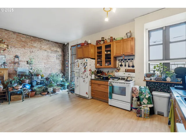 a kitchen with furniture and a stove