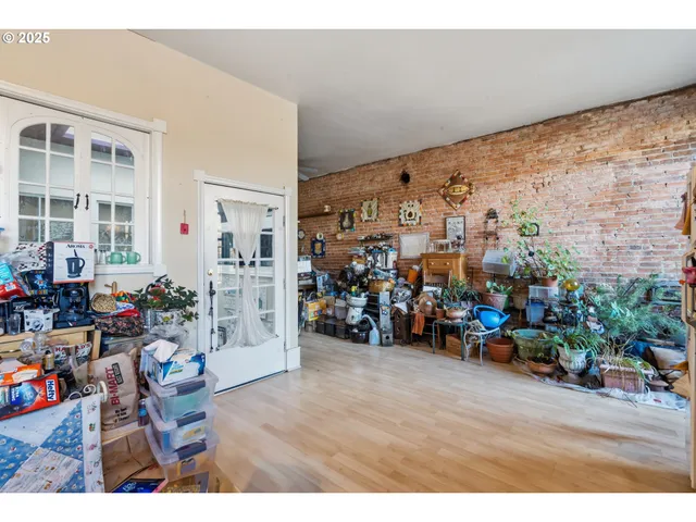 a view of a room with gym equipment and a window