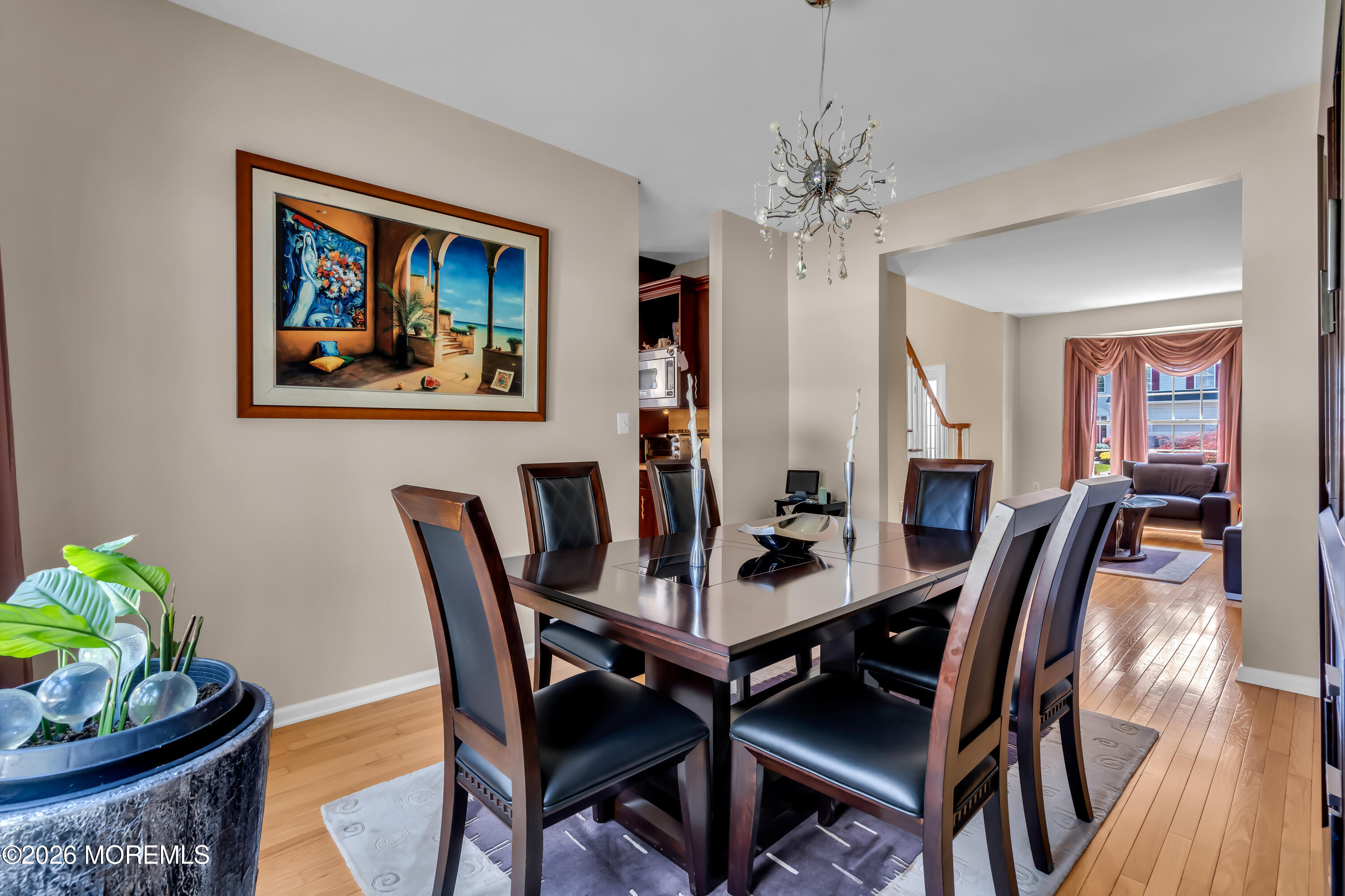 10 Beacon Place Old Bridge, NJ 08857 - Photo 29 of 72 a view of a dining room with furniture wooden floor and a chandelier