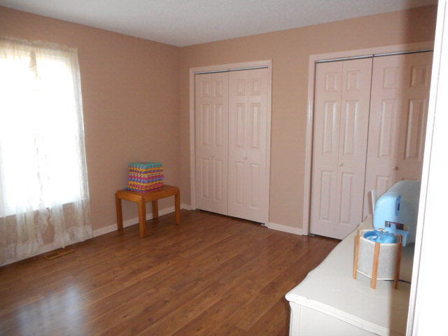 734 Joe Barnes Road Byron, GA 31008 - Photo 9 of 24 a living room with furniture and a wooden floor