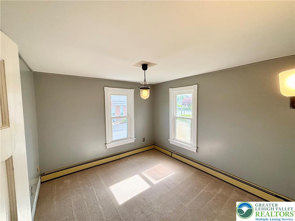 7241 Decatur Street New Tripoli, PA 18066 - Photo 18 of 36 Well-lit room features soft carpeting and baseboard heating, ready for your personal touch.
