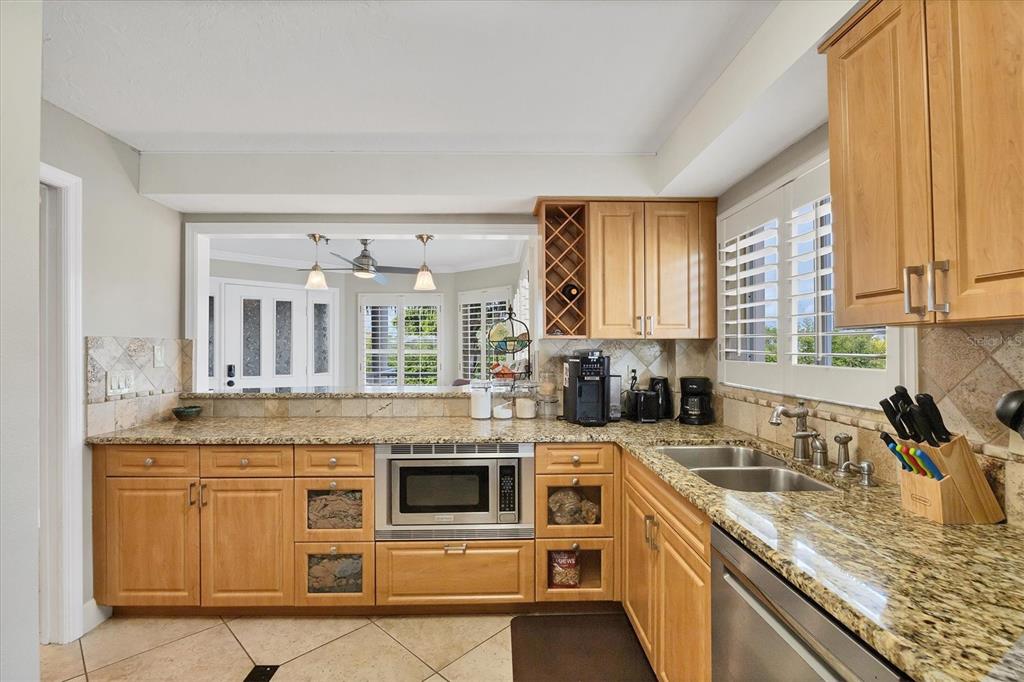 11000 Placida Road, Unit 1601 Placida, FL 33946 - Photo 14 of 58 a kitchen with stainless steel appliances granite countertop a stove and a sink