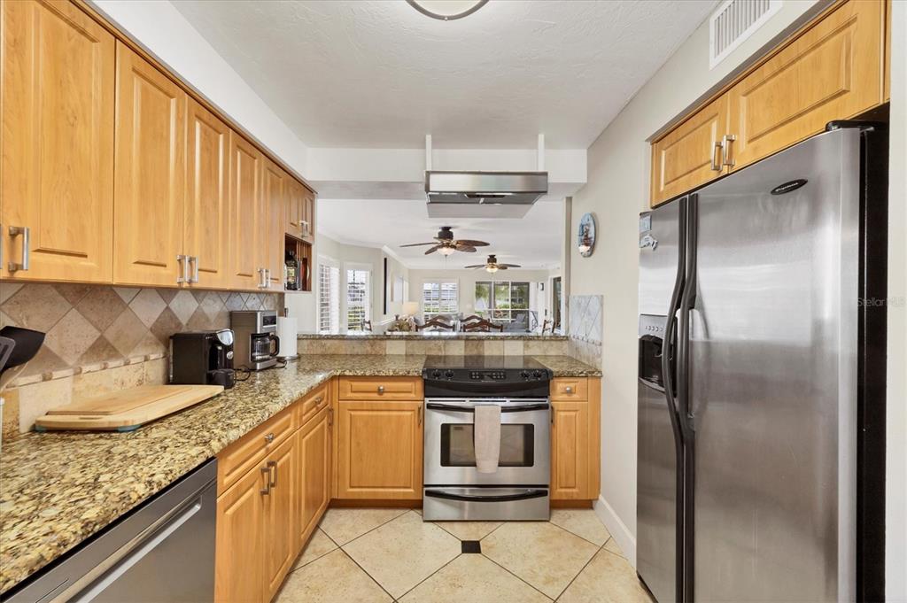 11000 Placida Road, Unit 1601 Placida, FL 33946 - Photo 15 of 58 a kitchen with a refrigerator sink and cabinets