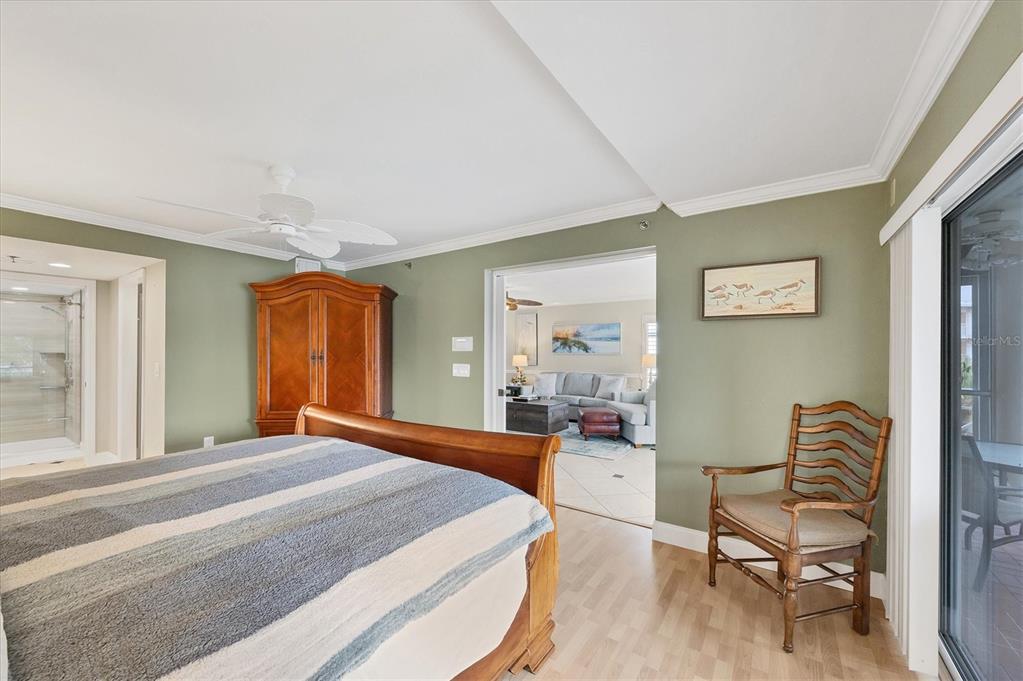 11000 Placida Road, Unit 1601 Placida, FL 33946 - Photo 19 of 58 a bedroom with a bed and wooden floor