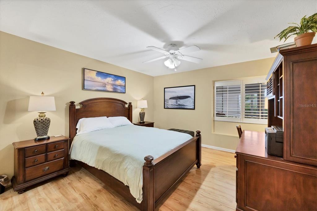 11000 Placida Road, Unit 1601 Placida, FL 33946 - Photo 23 of 58 a bedroom with a bed and wooden floor