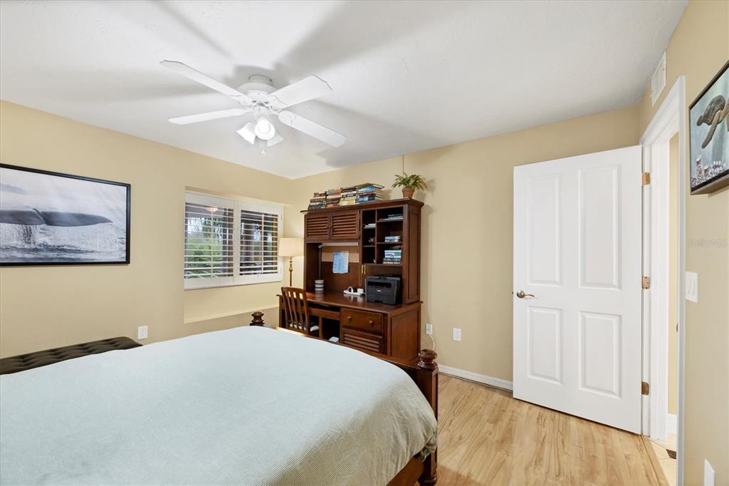 11000 Placida Road, Unit 1601 Placida, FL 33946 - Photo 24 of 58 a bedroom with a large bed and a window