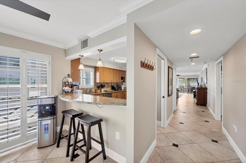 11000 Placida Road, Unit 1601 Placida, FL 33946 - Photo 5 of 58 a view of a kitchen with kitchen island cabinets and refrigerator