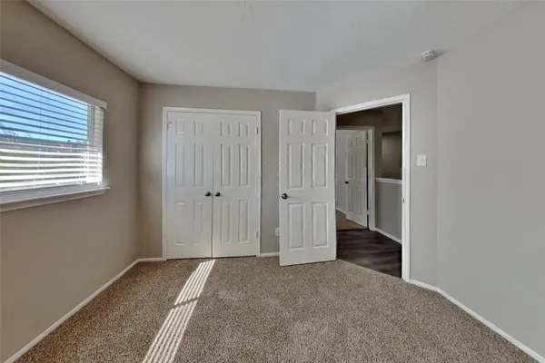 a view of hallway with closet