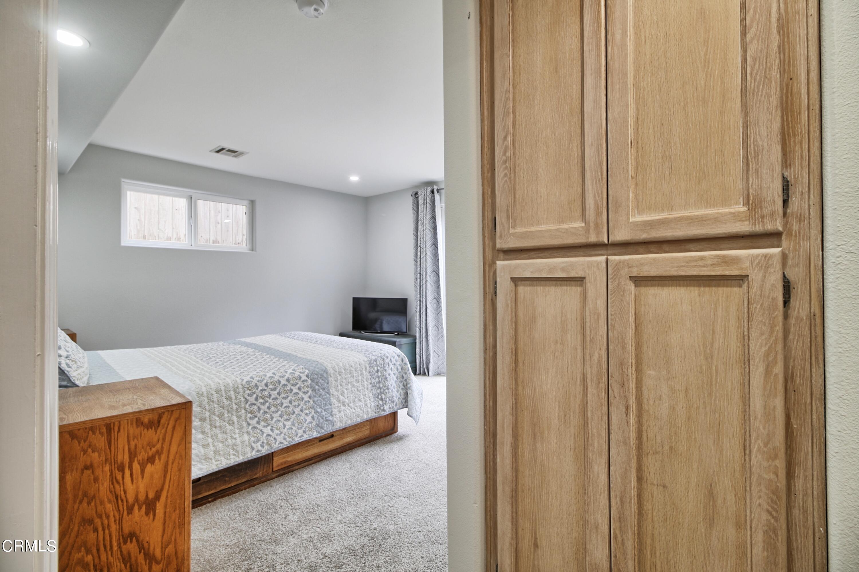 1516 Ocean Drive Oxnard, CA 93035 - Photo 28 of 42 a bedroom with a bed and a window