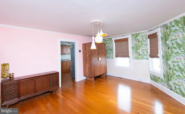 a view of a living room hardwood and kitchen
