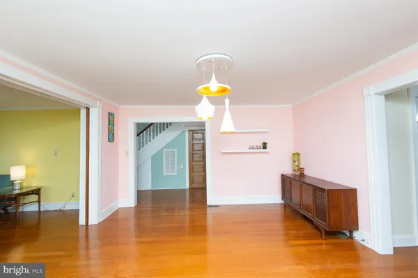 a view of a room window and wooden floor