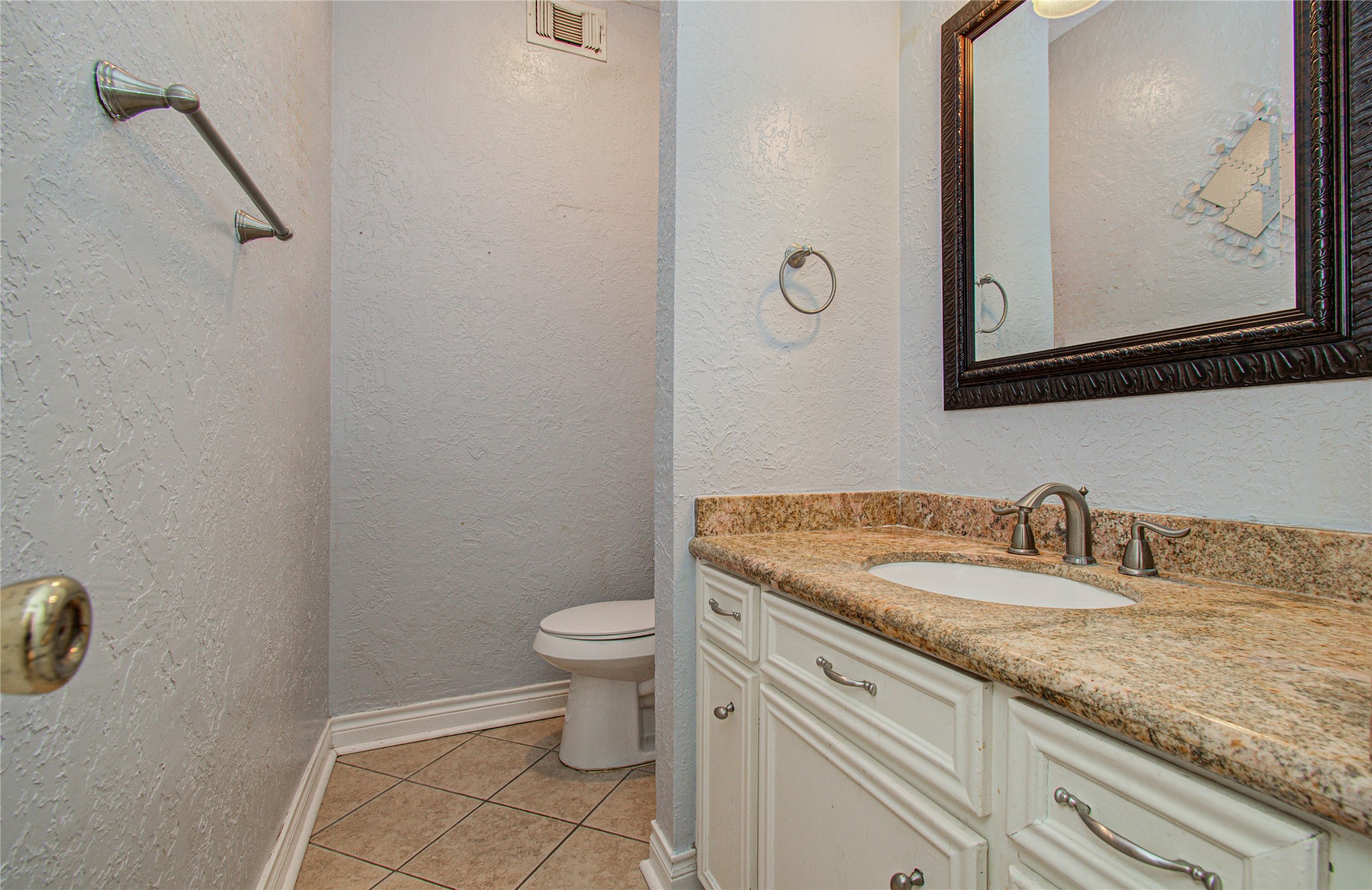 8103 Oak Moss Drive Spring, TX 77379 - Photo 20 of 33 a bathroom with a granite countertop sink and a mirror