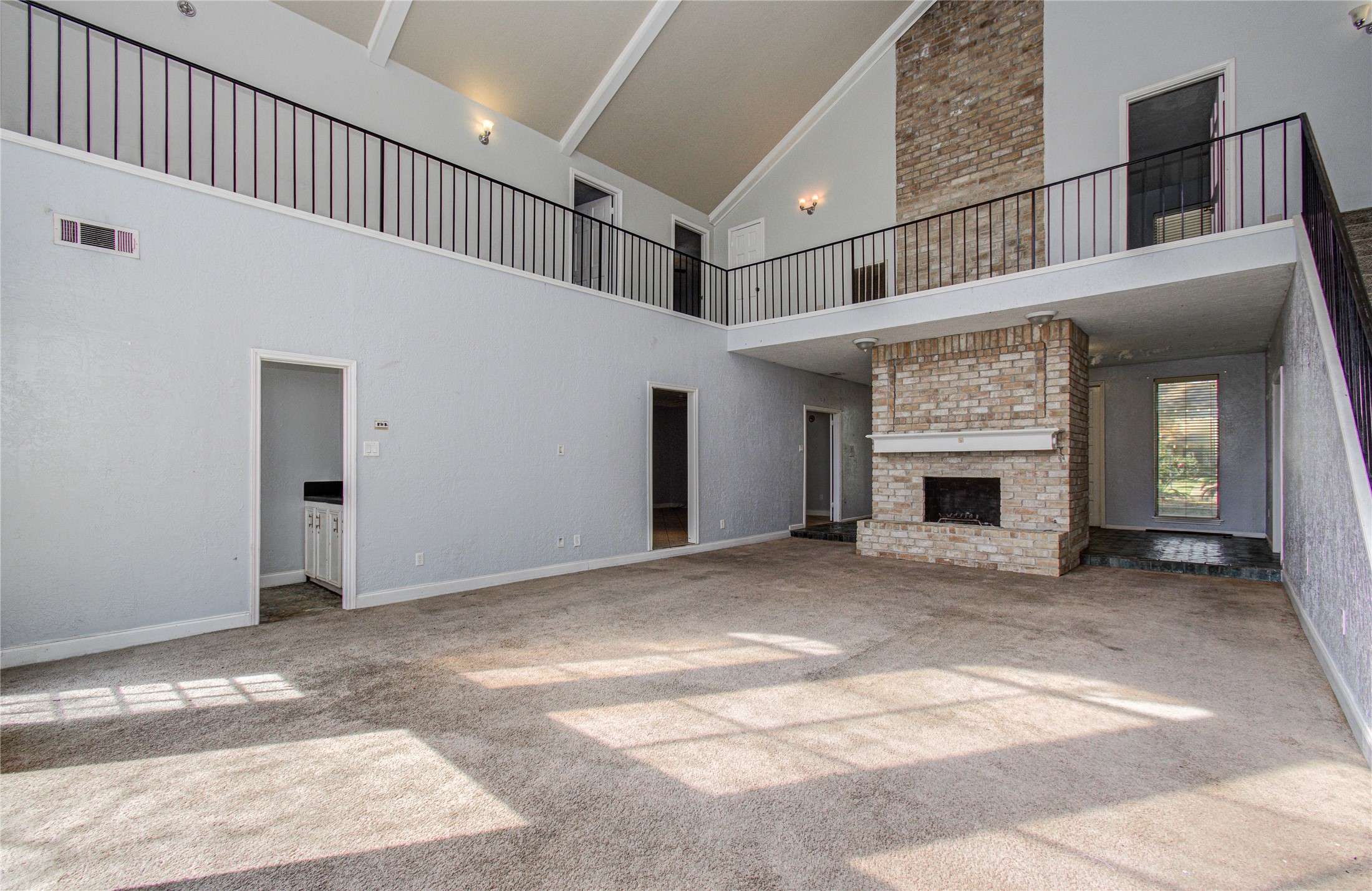 8103 Oak Moss Drive Spring, TX 77379 - Photo 23 of 33 a view of an empty room with a fireplace