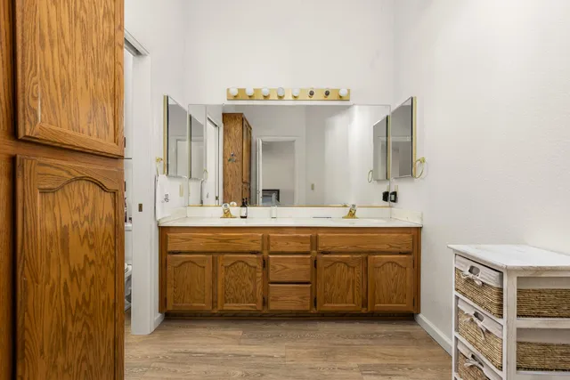 a spacious bathroom with a double vanity sink mirror and