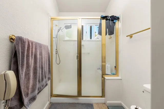 a view of a bathroom with mirror