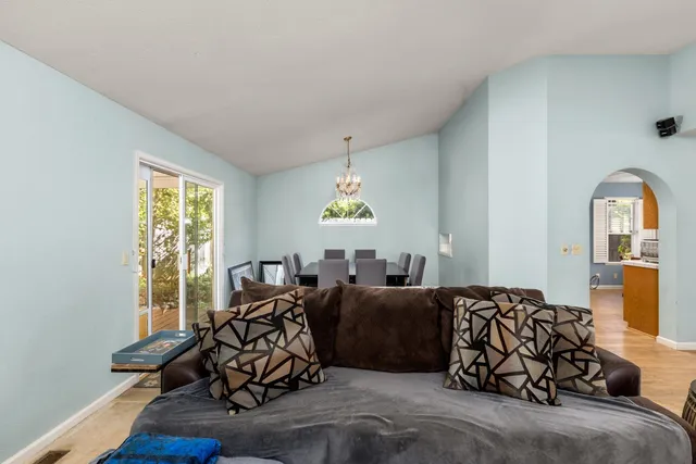 a bed room with large bed and a window