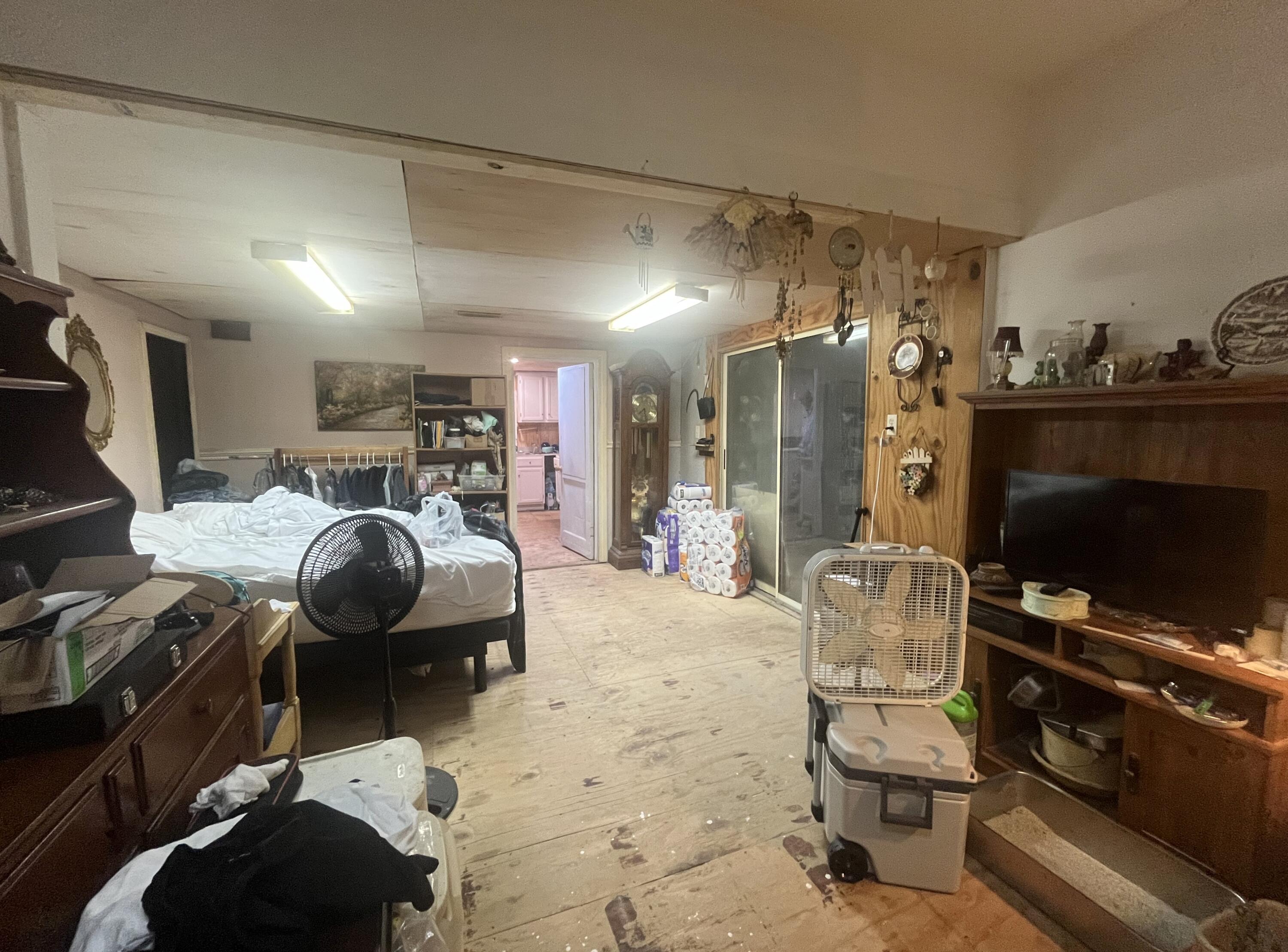 58 Hankins Road Freeport, FL 32439 - Photo 12 of 29 a bedroom with furniture and a flat screen tv