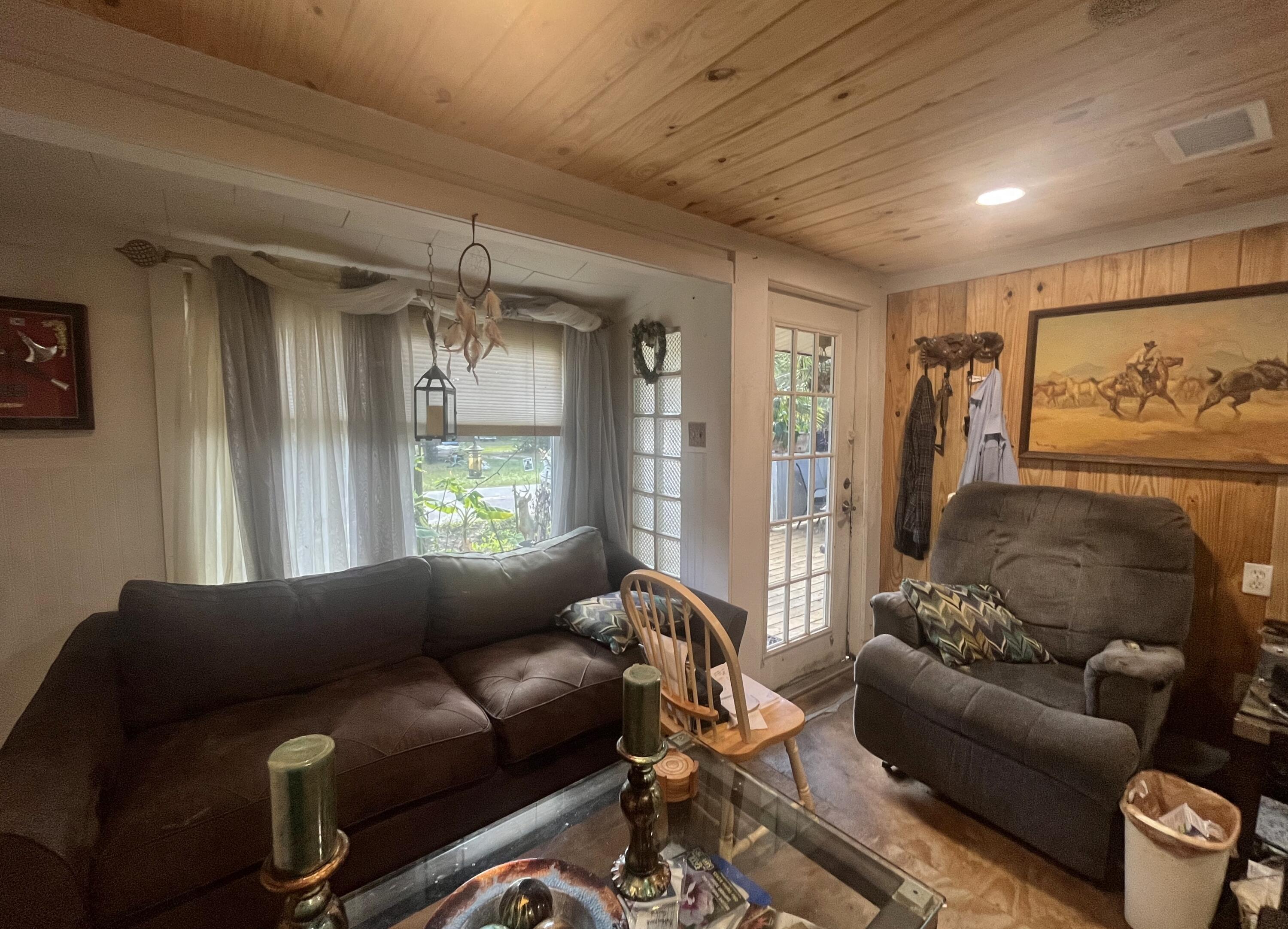 58 Hankins Road Freeport, FL 32439 - Photo 2 of 29 a living room with furniture and a window