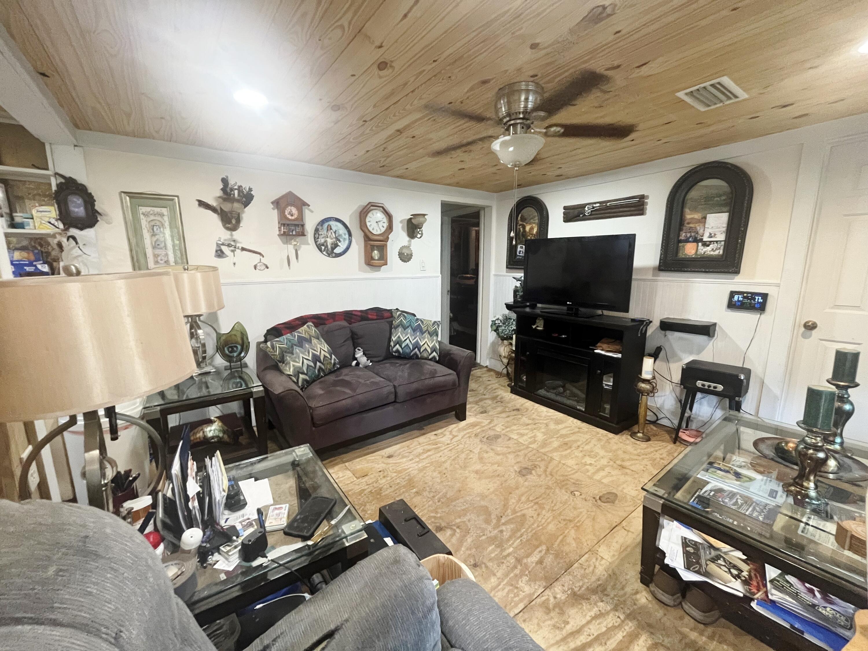 58 Hankins Road Freeport, FL 32439 - Photo 3 of 29 a living room with furniture and a flat screen tv